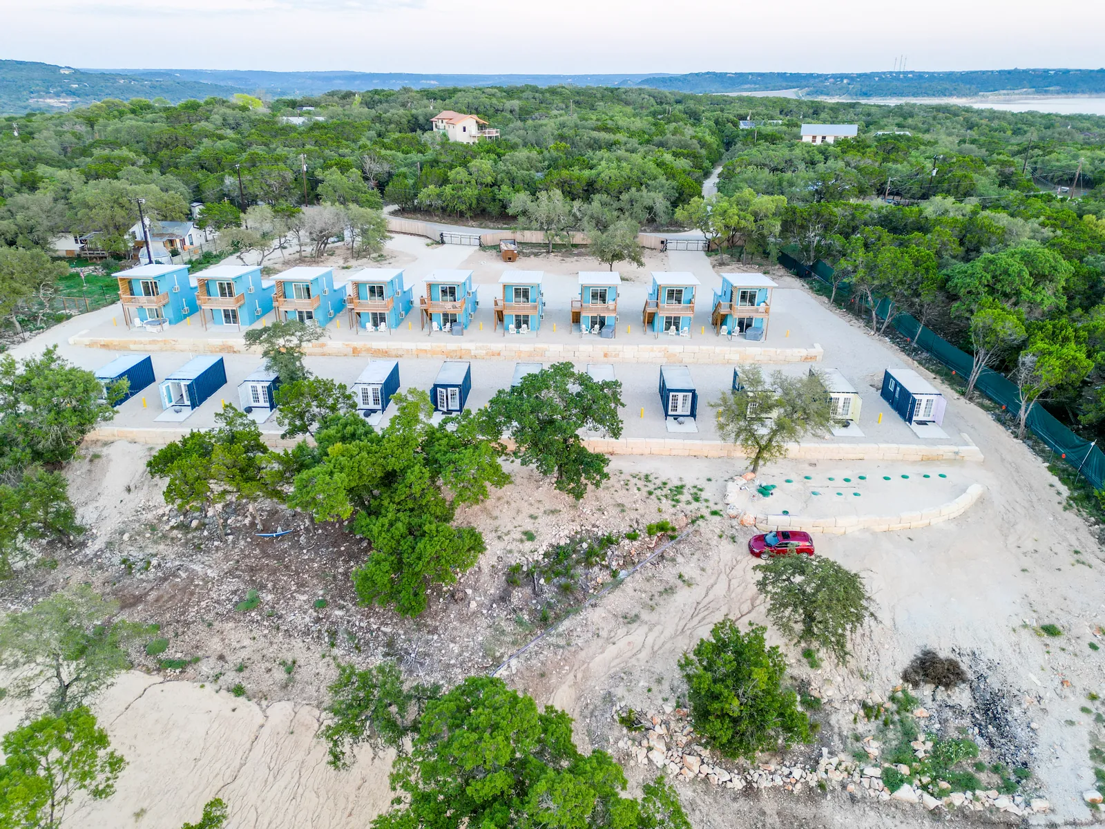 Aerial overview of The Container Retreat container-home community near Canyon Lake, Texas