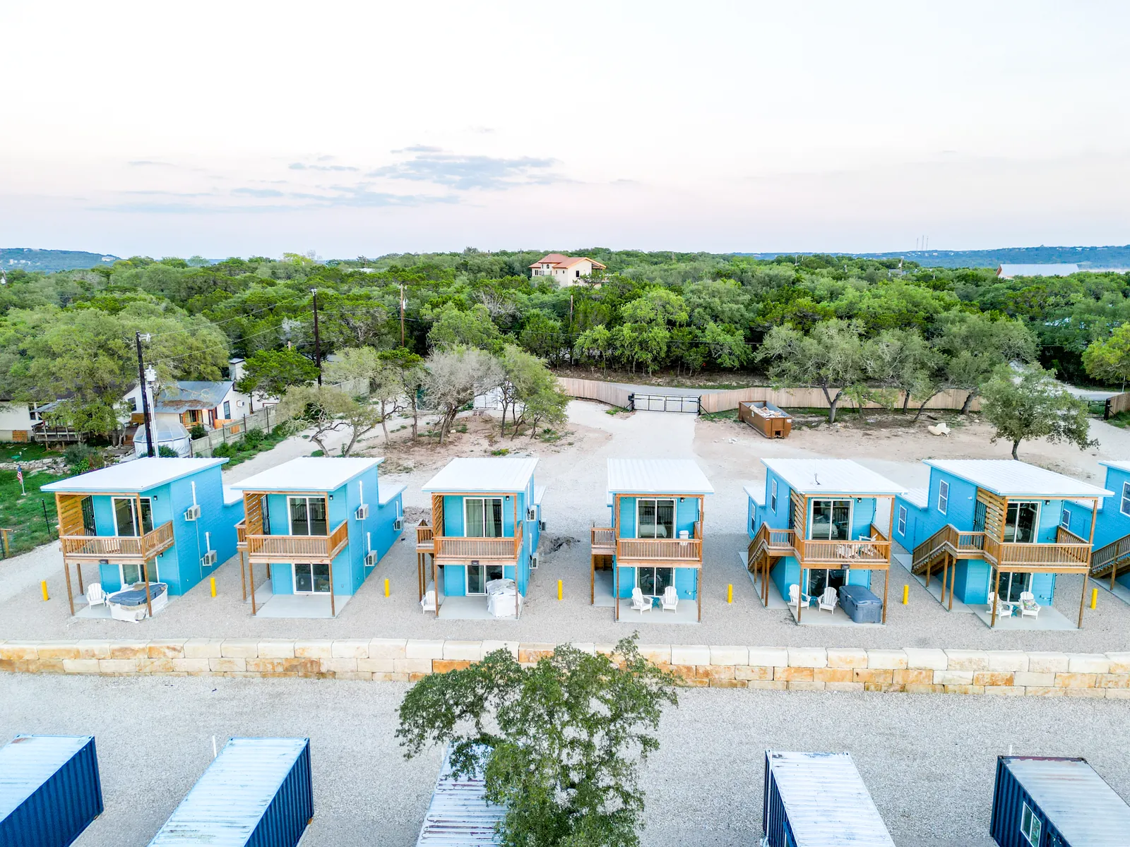 Front view of two-story furnished container homes with balconies and private decks in Canyon Lake, Texas